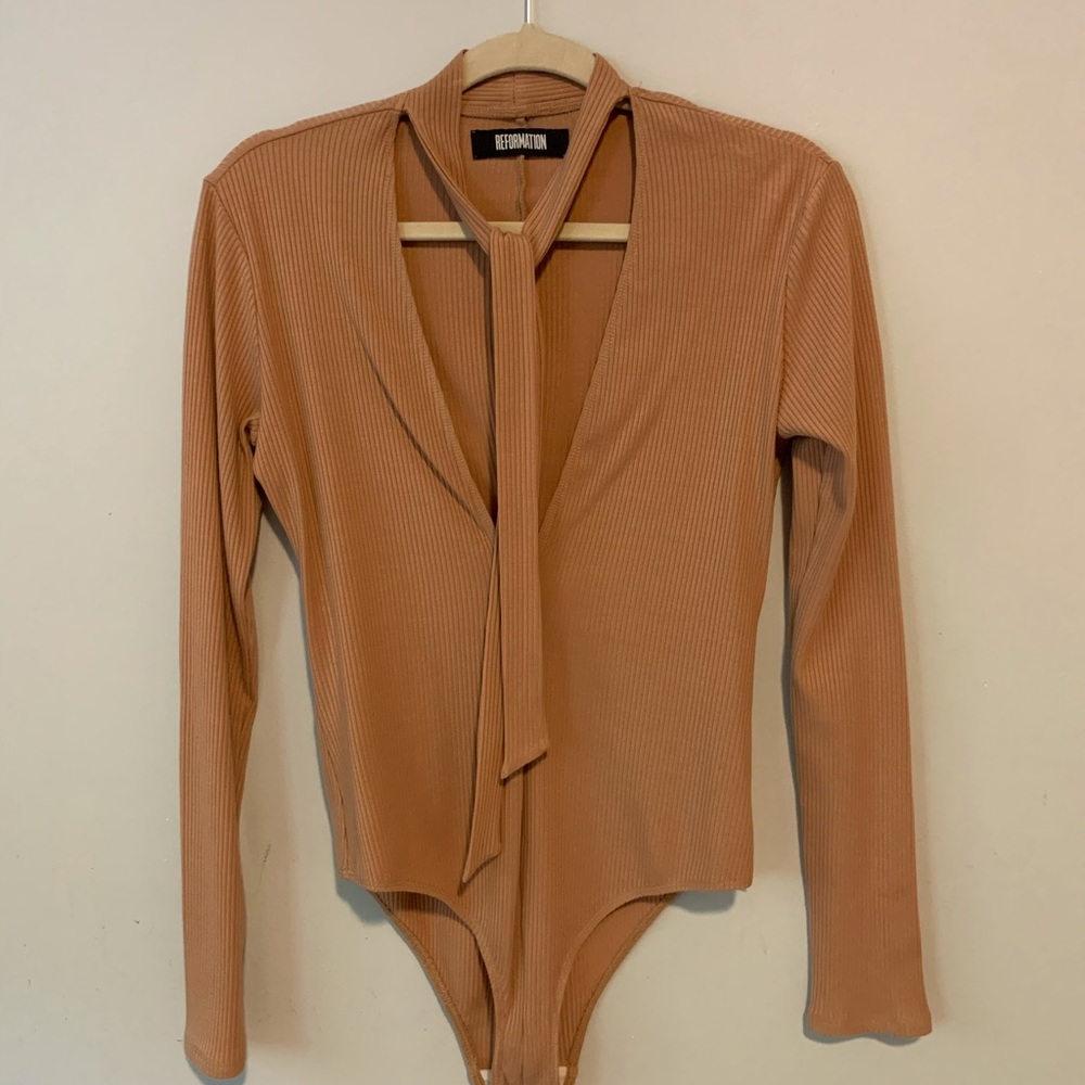 Ribbed bodysuit, necktie allows for multiple styling options. Very lightly worn